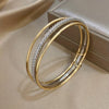Three Attached Gold and CZ Bangles