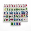 Whimsical Mahjong Tiles Featuring Bold Colored Winds