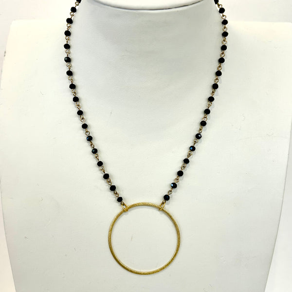 Black Beaded Necklace with Gold Ring