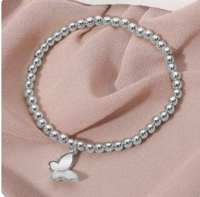 Beaded Stretch Bracelet with Dangling Mother of Pearl Butterfly Charm