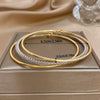 Three Attached Gold and CZ Bangles