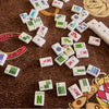 Whimsical Mahjong Tiles Featuring Bold Colored Winds
