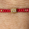 Red And Pink Braided Drawstring Bracelet With Gold Pave CZ Barrel Charm